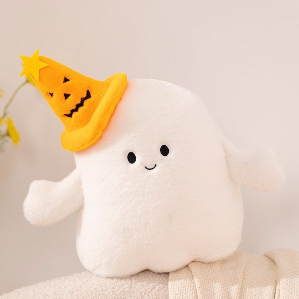 Halloween Ghost & Pumpkin Plushies: A single ghost plushie wearing a pumpkin hat is sitting on a couch