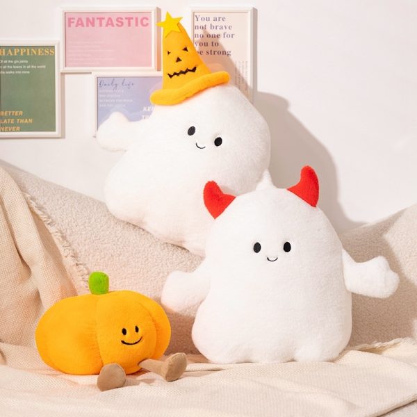 Halloween Ghost & Pumpkin Plushies: Three plushies are arranged on a couch, with a ghost, a pumpkin, and another ghost displayed